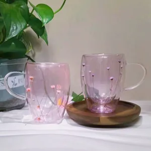 Double-walled glass mugs with dried pink flowers and ergonomic handles set of 2