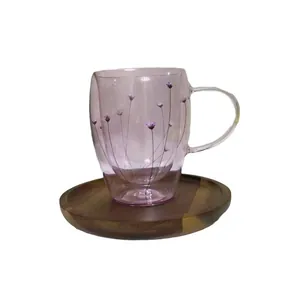 Double-wall glass mug with purple dried flowers and a solid wood coaster base