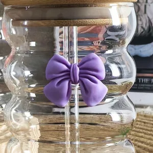 Detail of purple bow-knot straw charm on wave glass straw for minimalist tumblers
