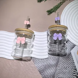 Cute bow glass cup with bamboo lid and straw featuring a creative ripple design