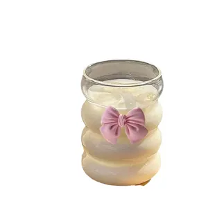 Cute rippled glass cup with pink bow and bamboo lid for creative milk tea drinks