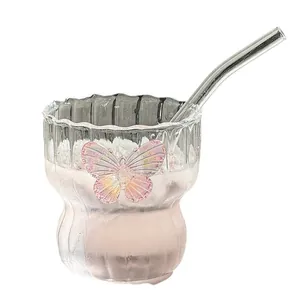 Vertical ripple glass coffee mug with pink butterfly ornament and clear glass straw