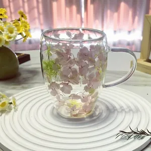 Double walled glass coffee mug with pink flowers and handle for home breakfast