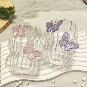 Handmade striped glass coffee cup with unique 3D butterfly accents and wave texture