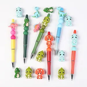 Cartoon dinosaur themed bead ballpoint pen set with colorful silicone decorations
