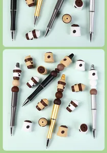 Close-up of DIY beaded ballpoint pens with coffee-themed 3D silicone beads and metallic pens