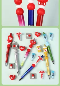 Detail view of medical-themed 3D silicone beads for pens including nurse and heart icons