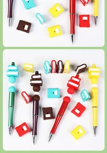 Detailed view of DIY bead pens featuring colorful 3D book-shaped silicone beads and metallic barrels