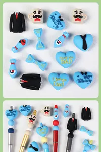 Close-up of Father's Day silicone beads with Happy Father's Day text on pens