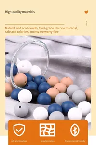 Macro detail of 12mm food-grade silicone beads in blue, white and grey for baby DIY