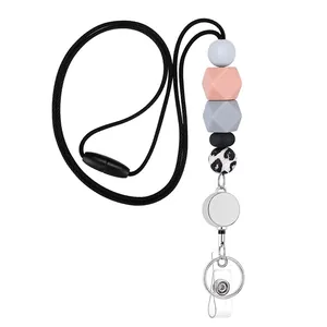 Detail of retractable silicone beaded lanyard with leopard print bead and silver metal clip