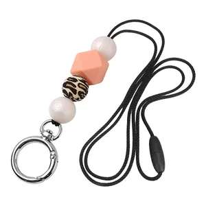 Detail of silicone beaded lanyard with leopard print bead and silver metal spring ring