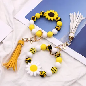 Sunflower silicone bead keychain set with leather tassel and daisy floral patterns