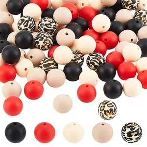 Macro view of assorted silicone beads including red, black, and leopard print DIY beads