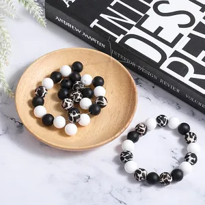 Macro detail of silicone beads set in black white and leopard print for DIY jewelry