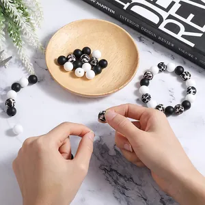 Macro view of leopard print and solid silicone beads for DIY handmade jewelry crafts