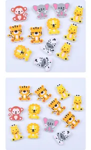 Detail view of colorful cartoon animal silicone charms including lion, elephant, and monkey