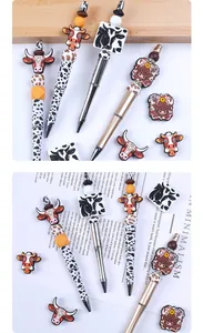 Detail of DIY highland cow silicone beaded pens with creative cartoon cattle patterns