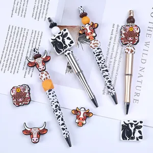 DIY beadable pen set with highland cow silicone beads and metallic leopard pattern