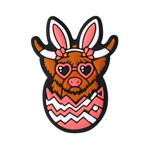 Easter Highland Cow silicone shoe charm with rabbit ears and colorful egg design