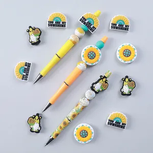 Set di cancelleria girasole con penne a sfera decorate e ciondoli in PVC a forma di gnomo