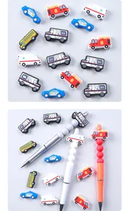Detailed view of DIY beadable pens with assorted silicone cartoon vehicle charms