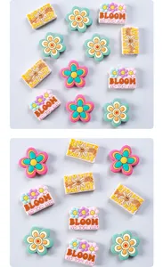 Detail of floral silicone charms and rectangular pieces with motivational quotes for shoes