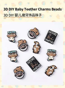 Macro detail of food-grade silicone teething beads with cartoon cow and cowboy motifs