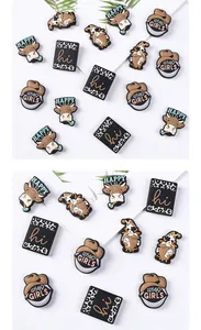 Detail of Western cowboy and cow themed PVC charms for clogs with unique artistic patterns