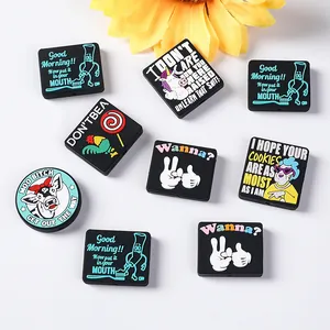 Flat lay of colorful silicone charms and DIY beads with American humor graphic patterns