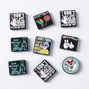 Detailed view of colorful PVC shoe charms featuring humorous slogans and cute cartoon icons