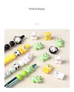 Close-up of 3D cartoon animal silicone beads including cat dog frog and penguin designs