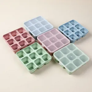 Collapsible silicone ice cube trays with lids in pastel colors organized in a grid
