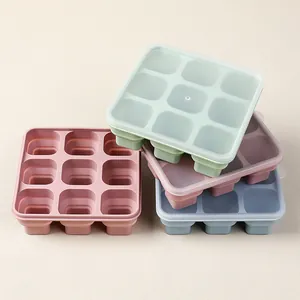 Stack of 9-grid foldable silicone ice cube trays with lids in assorted Morandi colors