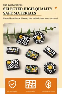 Close-up of food-grade silicone smiley face beads and checkered patterns for DIY jewelry