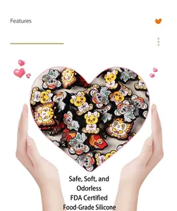 Detailed view of FDA food-grade silicone animal charms held in hands for shoe decoration