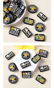 Detail of smile face silicone beads and One Happy Mom checkerboard patterns for DIY crafts