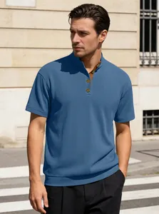 Detail of the blue polo shirt showing vertical ribbed texture and brown collar lining