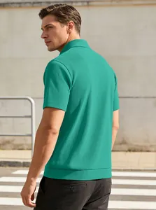 Detail of teal men's short sleeve polo shirt showing vertical embossed texture outdoors