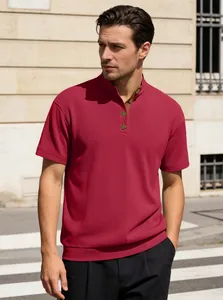 Detail of red men's corduroy henley polo shirt with vintage metal buttons on street