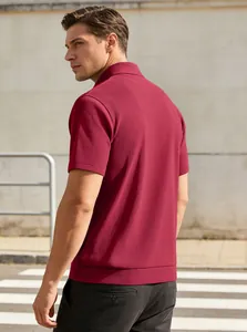 Detail of burgundy polo shirt with textured vertical pleats and fitted cuffs