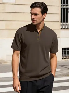 Detail of dark brown men's corduroy Henley shirt showing vintage buttons and ribbed texture