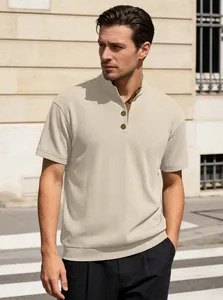 Detail of men's ribbed knit Henley neck shirt with three-button placket in cream white