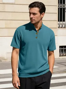 Detail of teal corduroy knit polo shirt showing textured vertical stripes and retro buttons