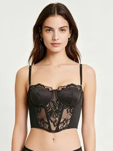 Close-up of black lace corset top with satin cups and visible boning structure