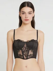 Close-up of black lace corset top with floral embroidery and adjustable straps