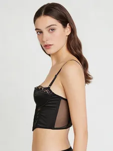 Side view of black satin corset top with fine lace trim and adjustable shoulder straps