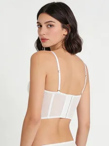 Detail of white lace corset back with fishbone support and adjustable hook-and-eye closure