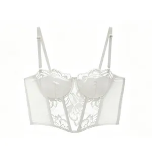 Detailed view of white corset top with lace panels, satin cups, and boning structure
