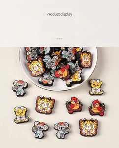 Detail view of colorful silicone animal beads featuring red birds and koalas for DIY